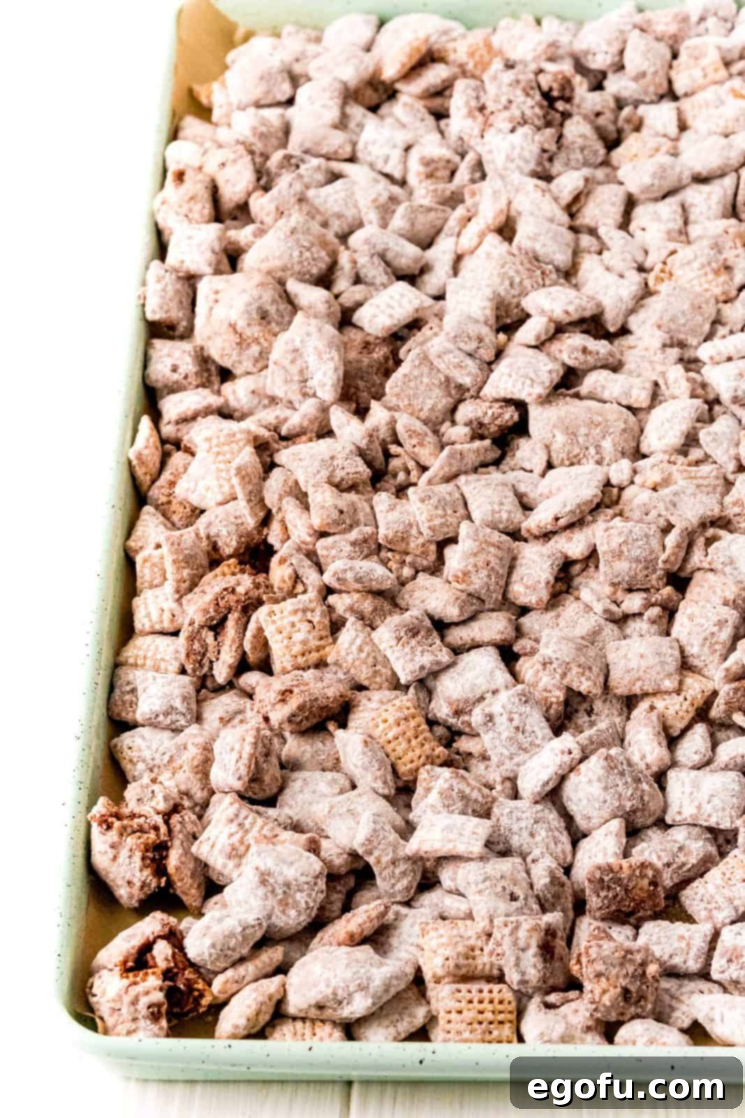 Puppy Chow on baking sheet to set up.