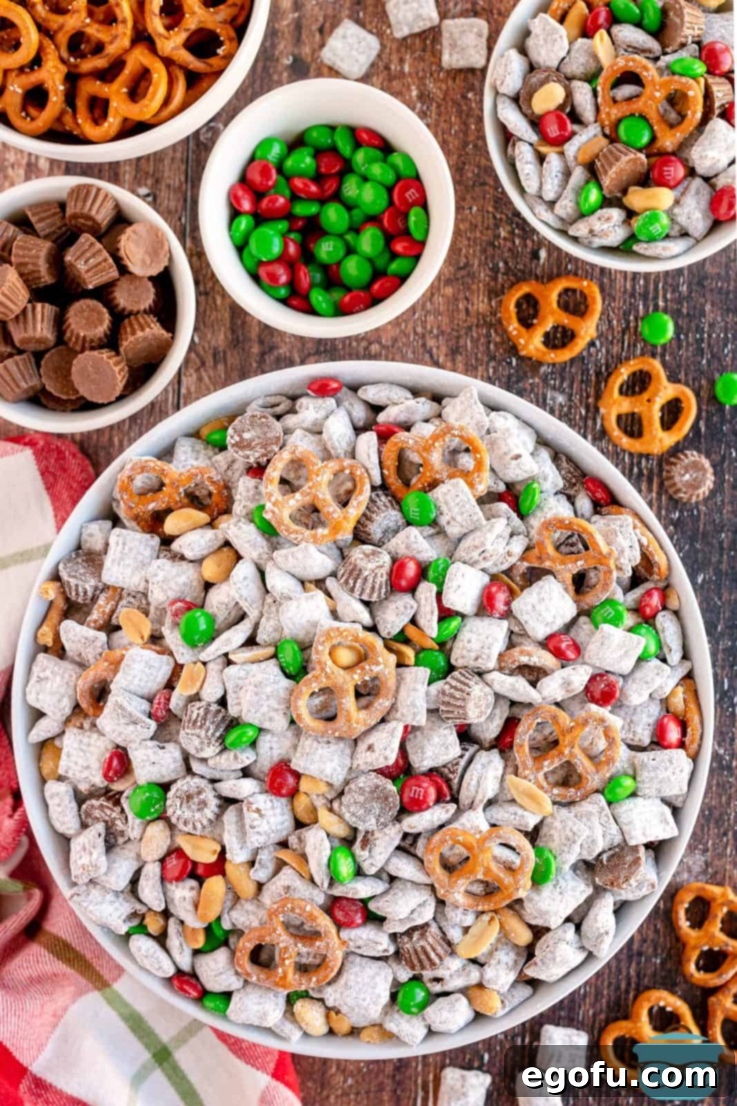 Overhead of Reindeer Chow in white bowl with ingredients next to bowl.