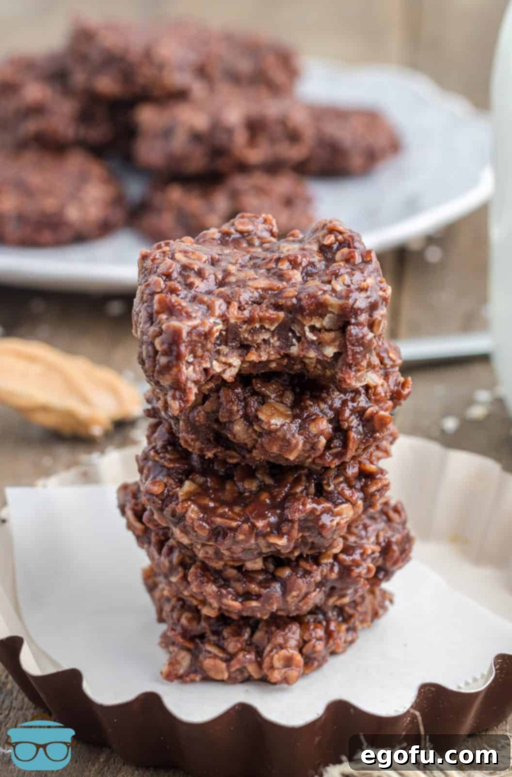 Grandma's No Bake Cookies stacked with bite taken out of top one.