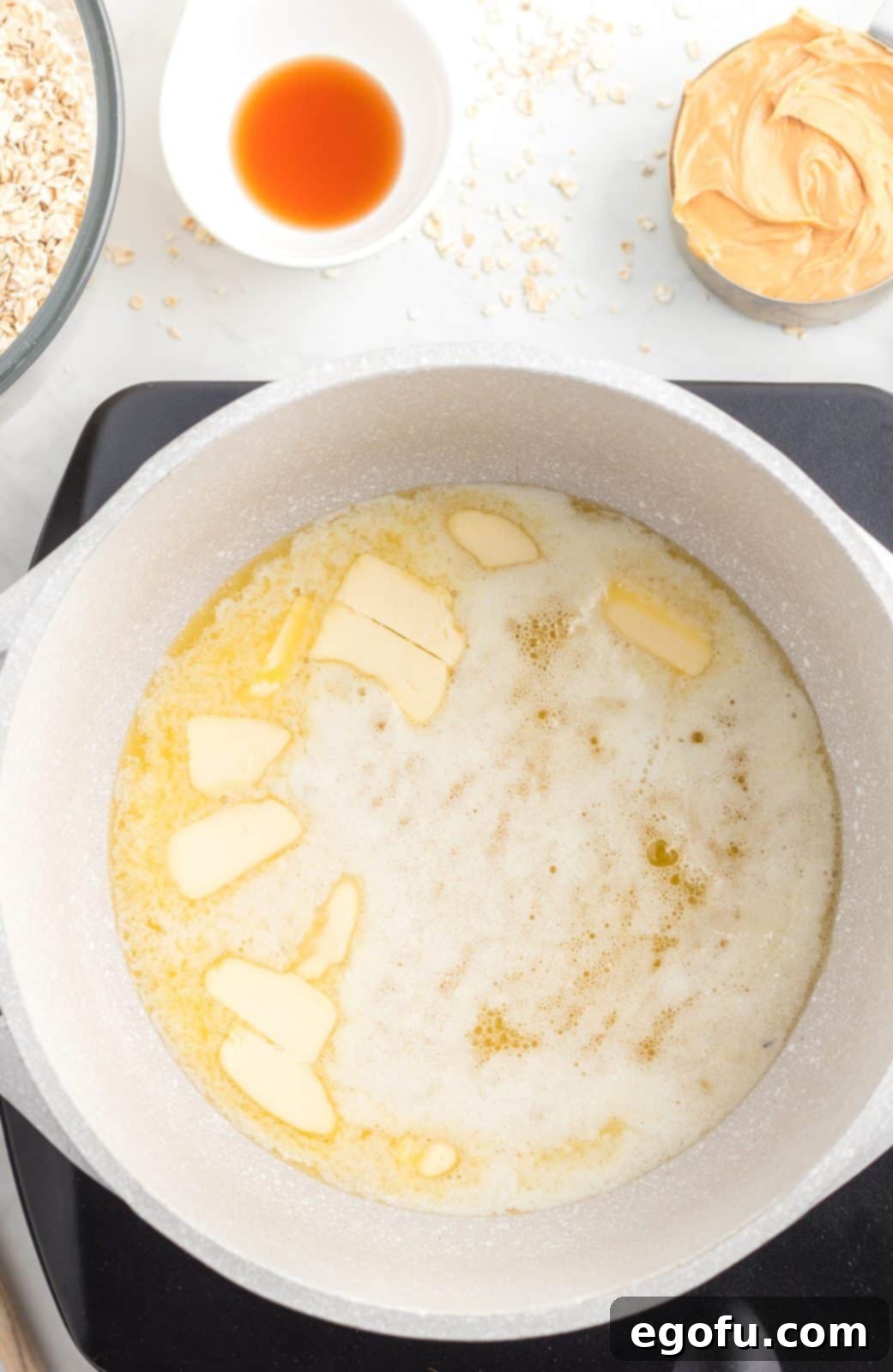 Butter being melted in pan.