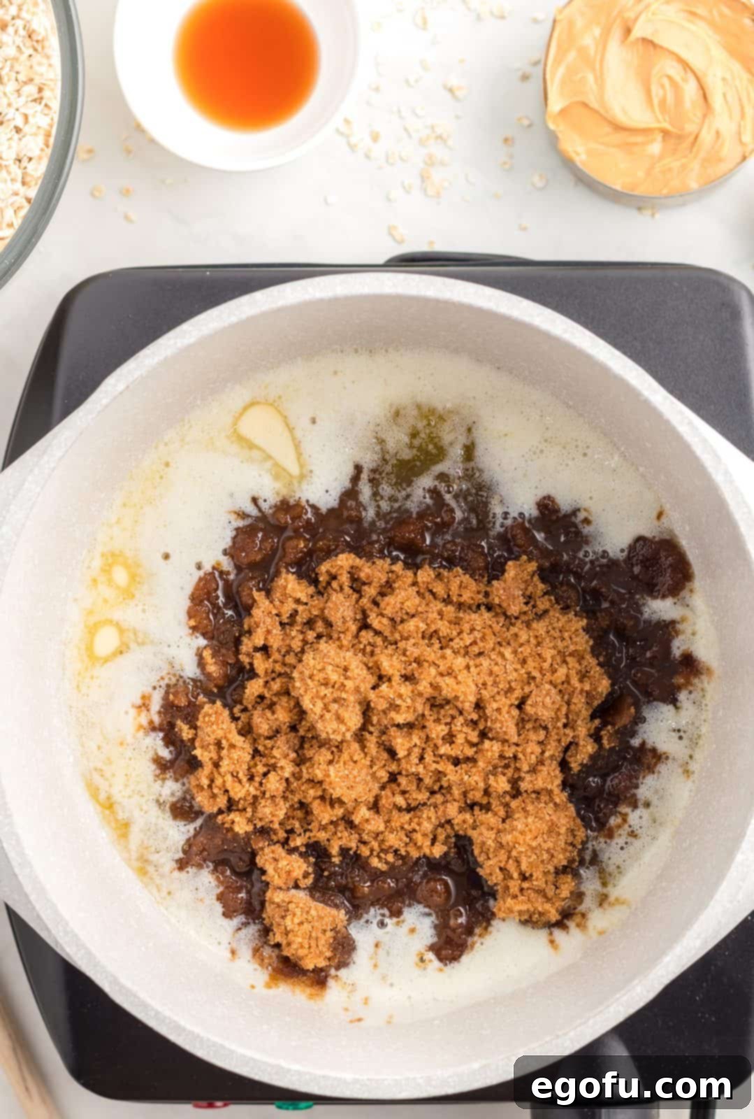 Brown sugar added to melting butter in pan.