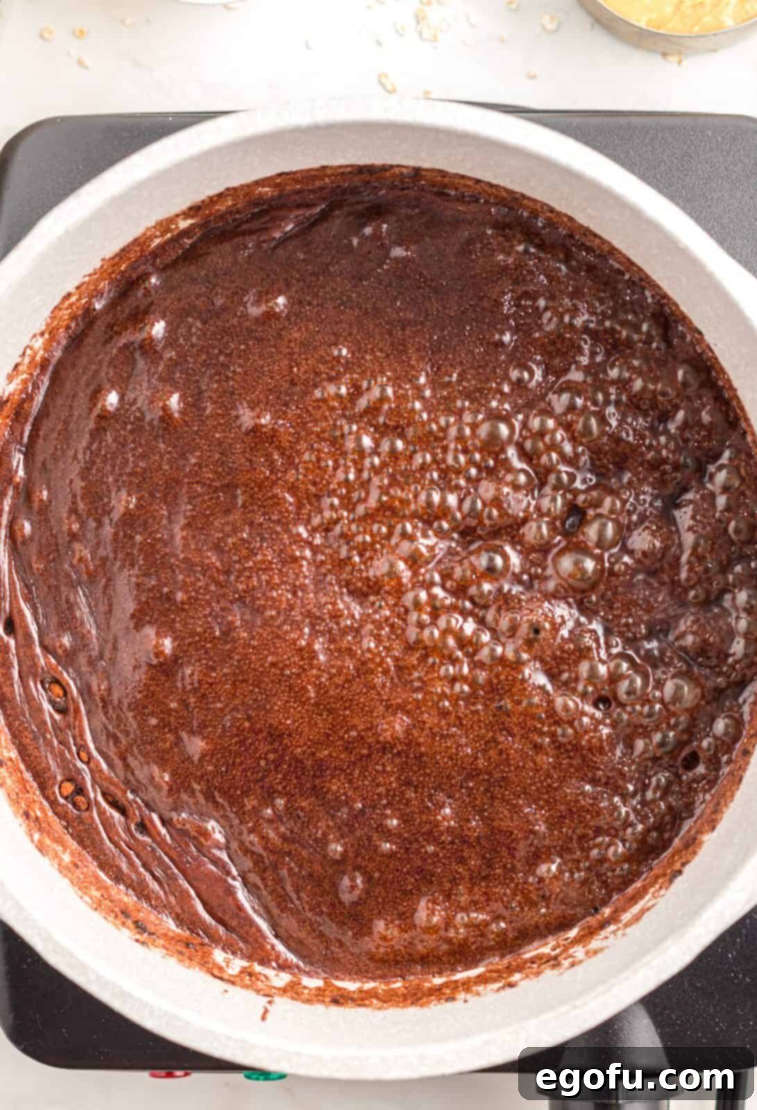 Mixture boiling on stovetop.