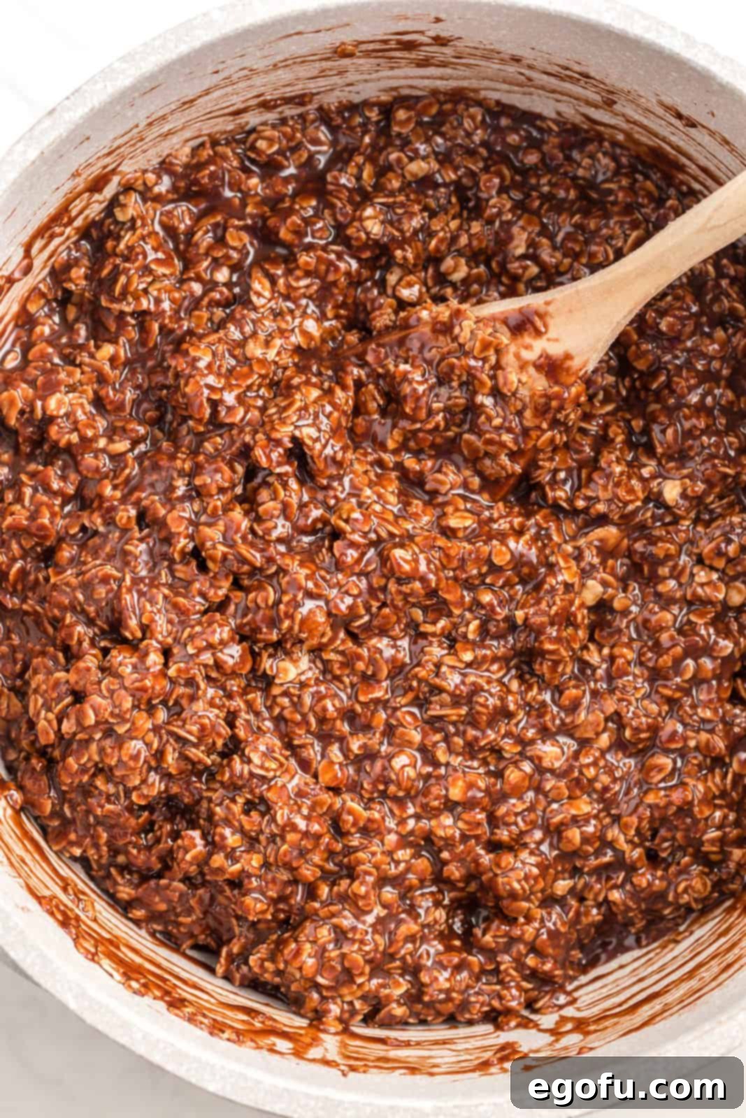 Oats and salt added to pan and stirred together.