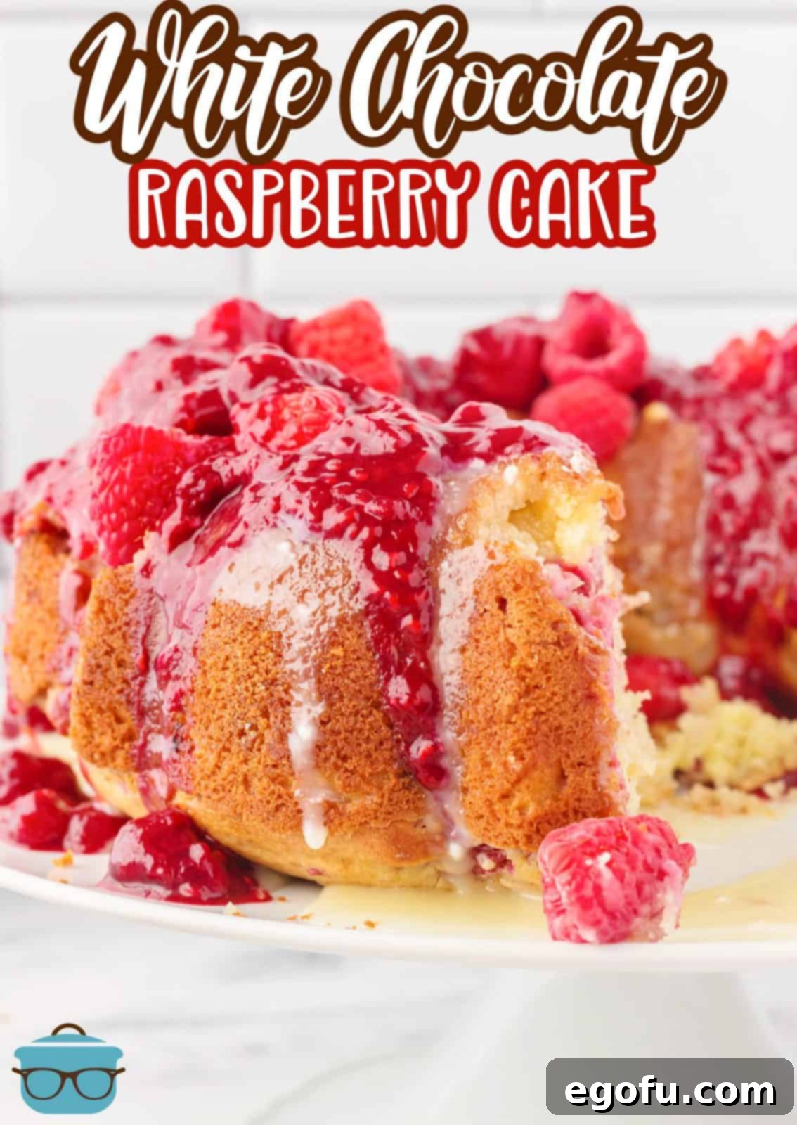 Pinterest image of White Chocolate Raspberry Cake with slies missing on platter.