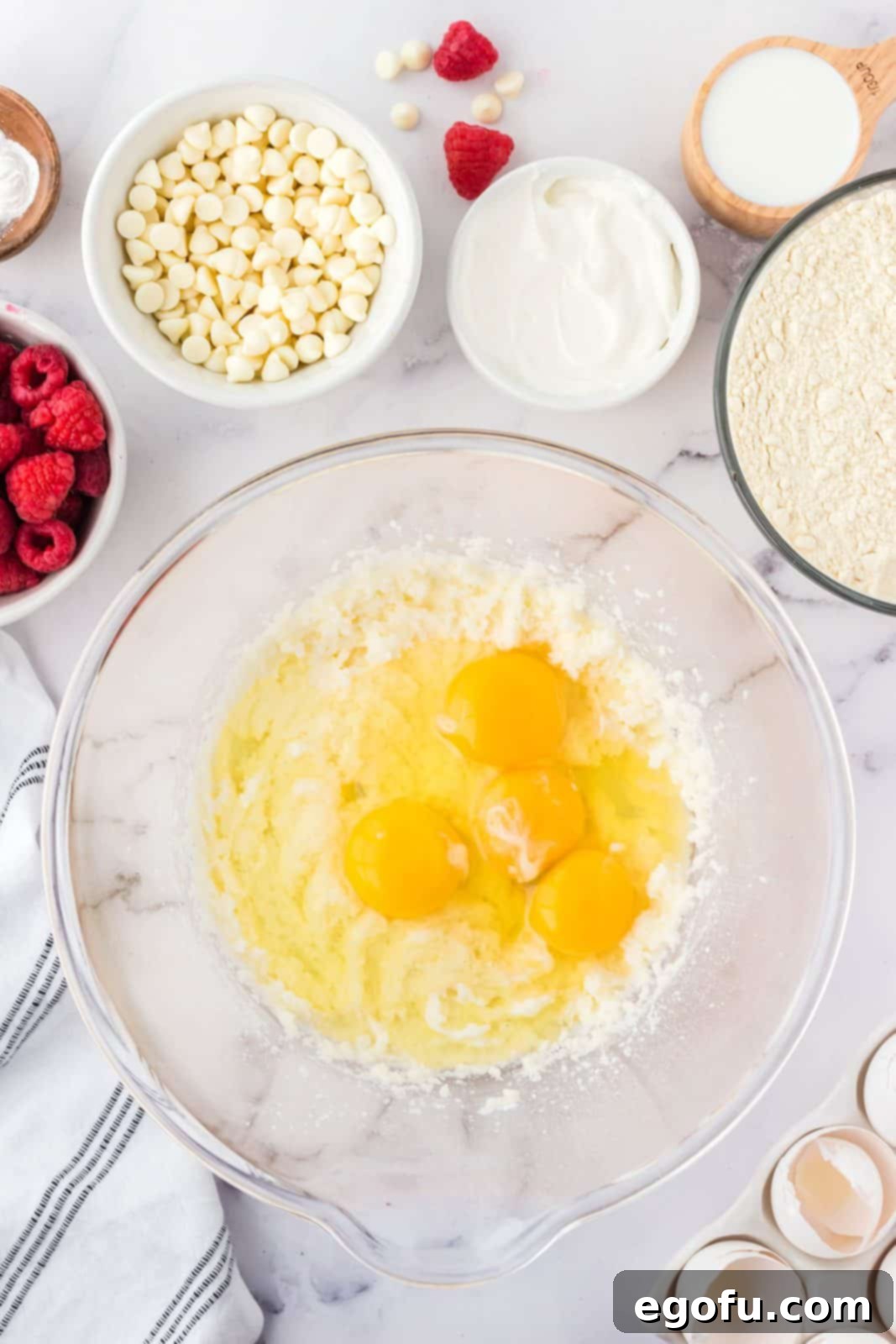 Beated butter and sugar with eggs added to bow.