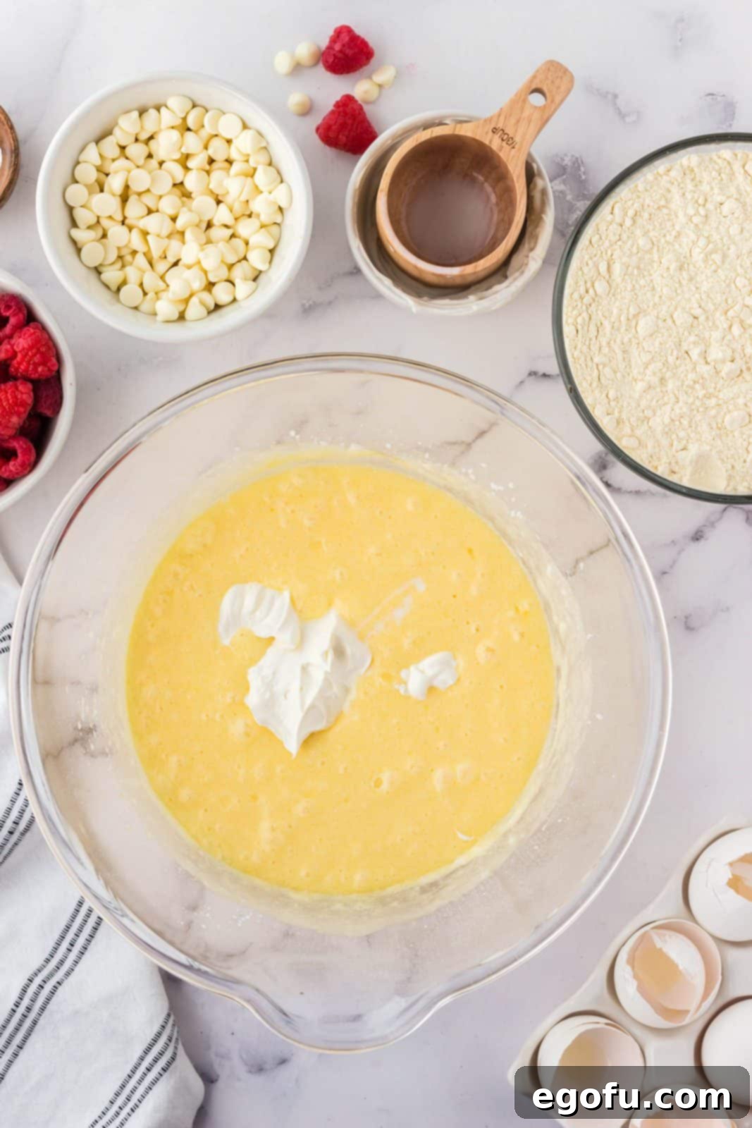 Sour cream added to butter and egg mixture.