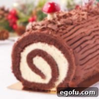 Square image close up of Christmas Yule Log Cake showing inside swirl.