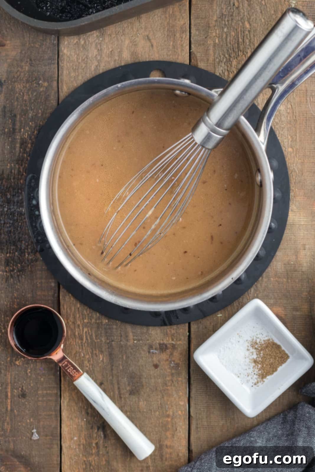 Beef stock mixed into dripping mixture.