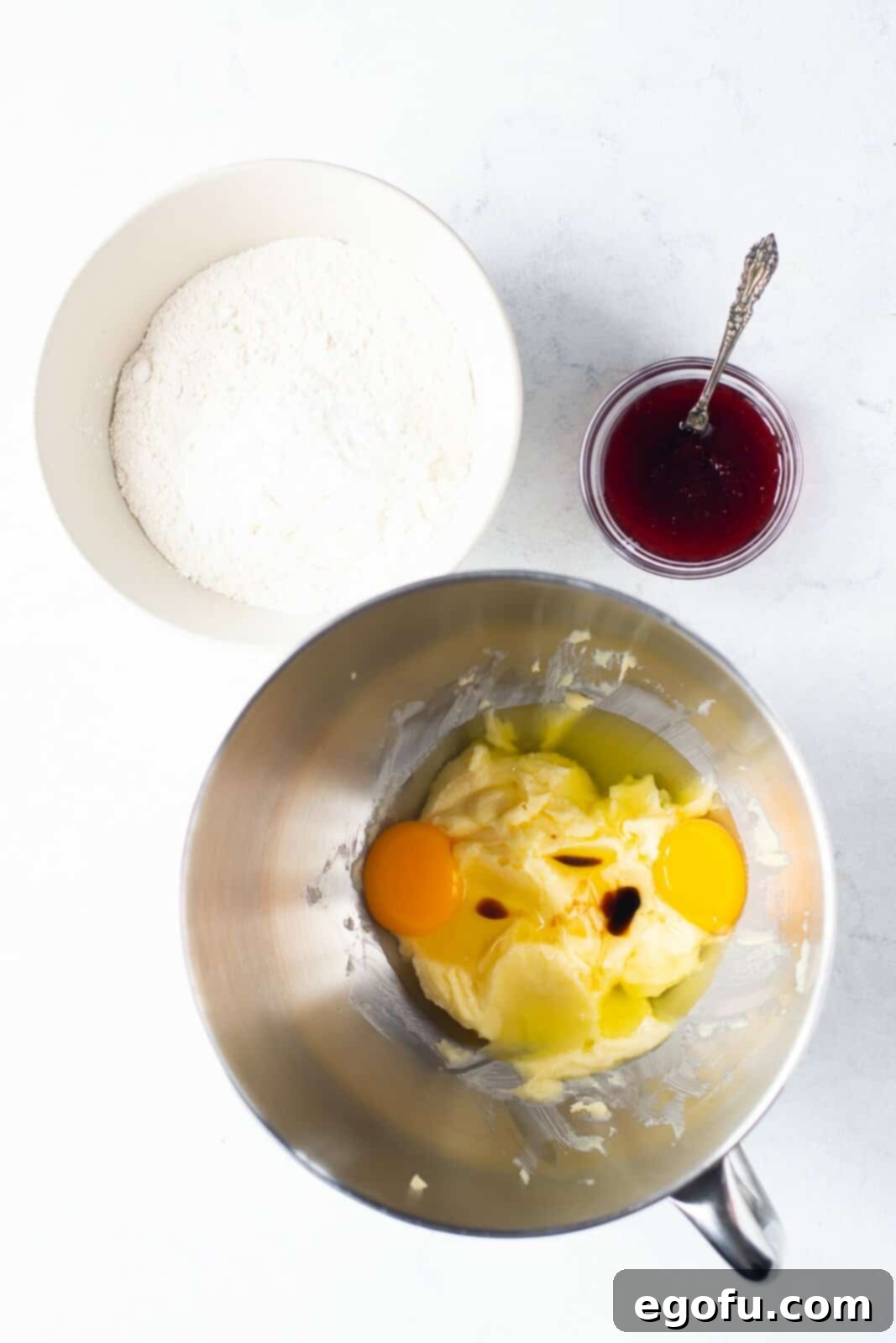 Eggs added to butter and sugar mixture.