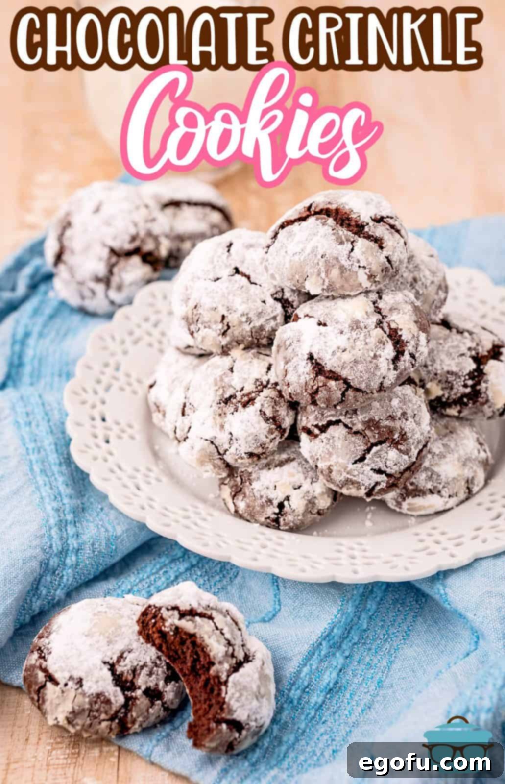 Pinterest image of plate of Chocolate Crinkle Cookies and two cookies on linen with a bite taken out of one.