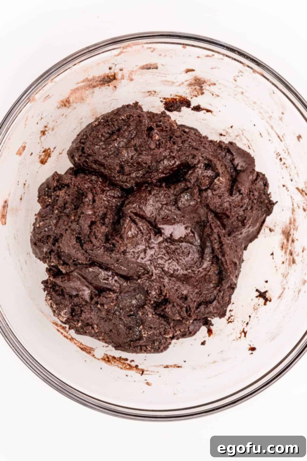 Cookie dough in clear bowl.