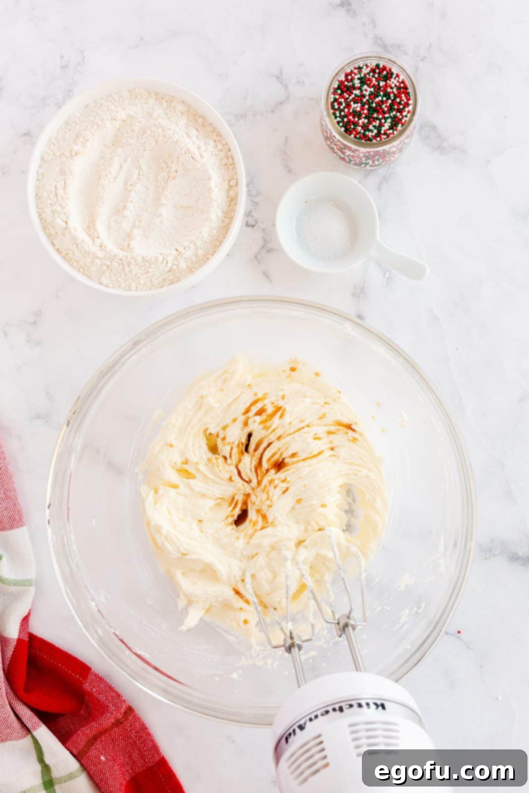 Butter, sugar, and extracts beaten together in a mixing bowl until light and fluffy.