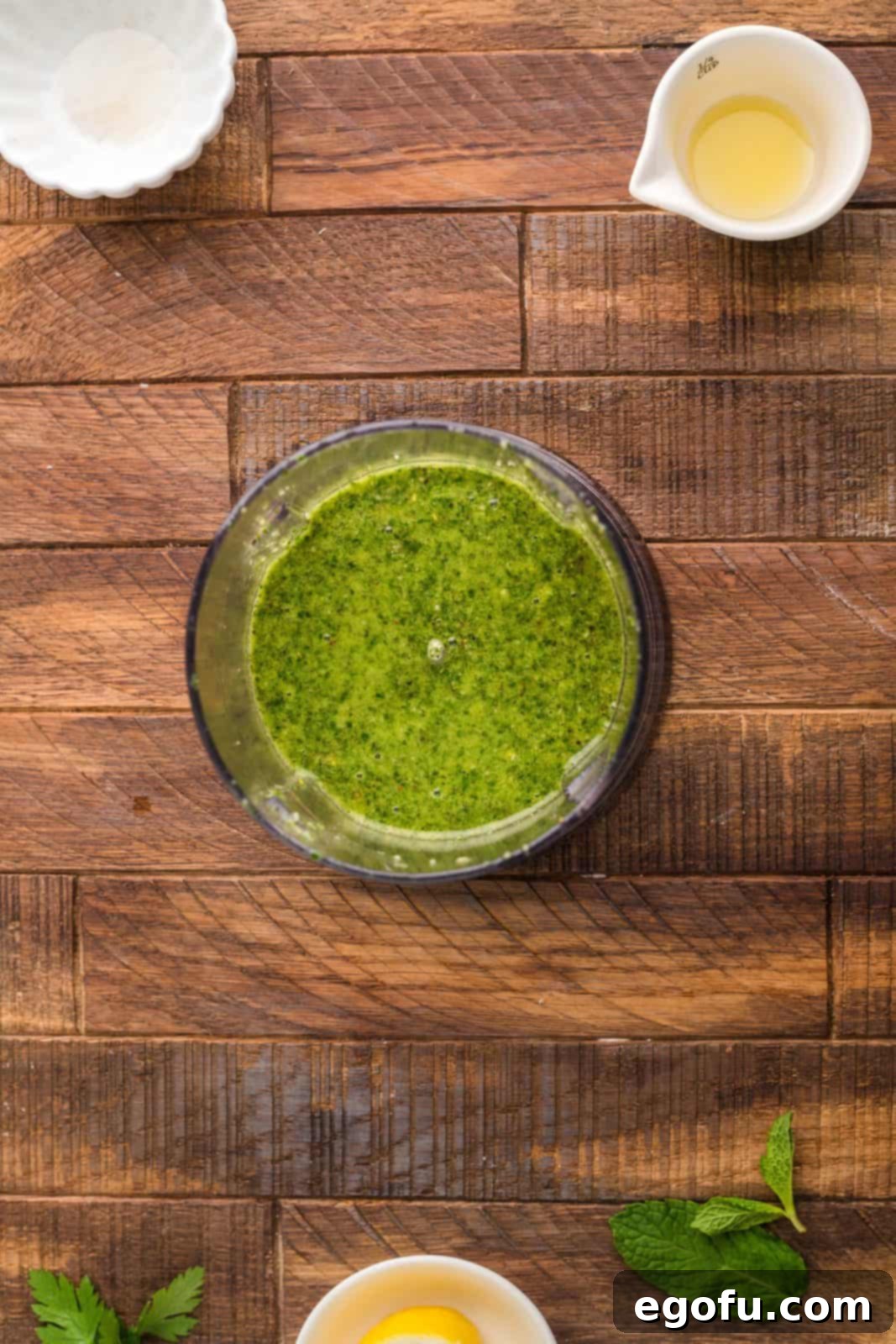 Succulent Lamb Chops 12 Smooth, vibrant green mint pesto resting in the food processor bowl after being perfectly puréed, ready to be served.