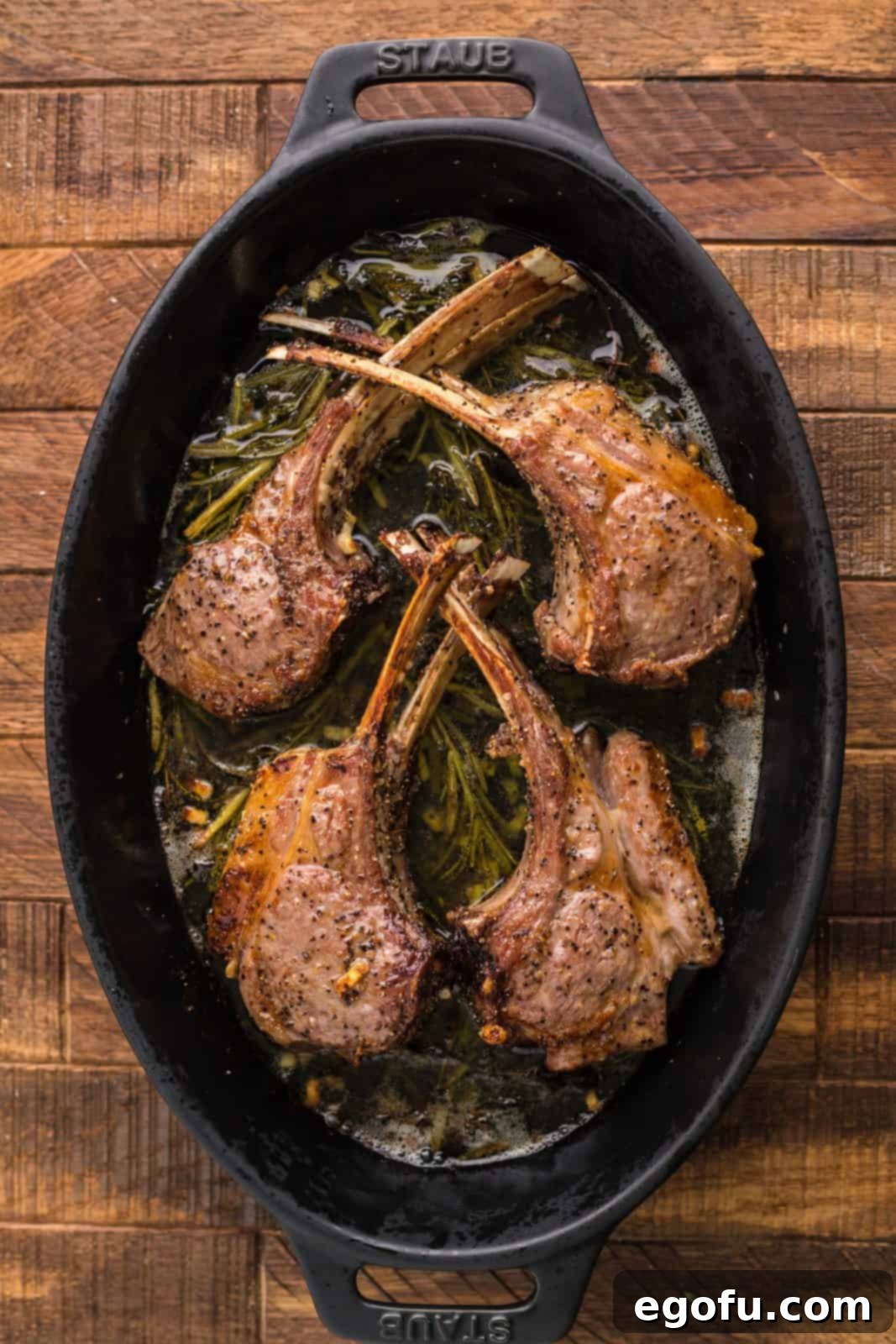 Succulent Lamb Chops 9 A perfectly broiled lamb chop, golden brown and juicy, just removed from the oven and resting in the pan.