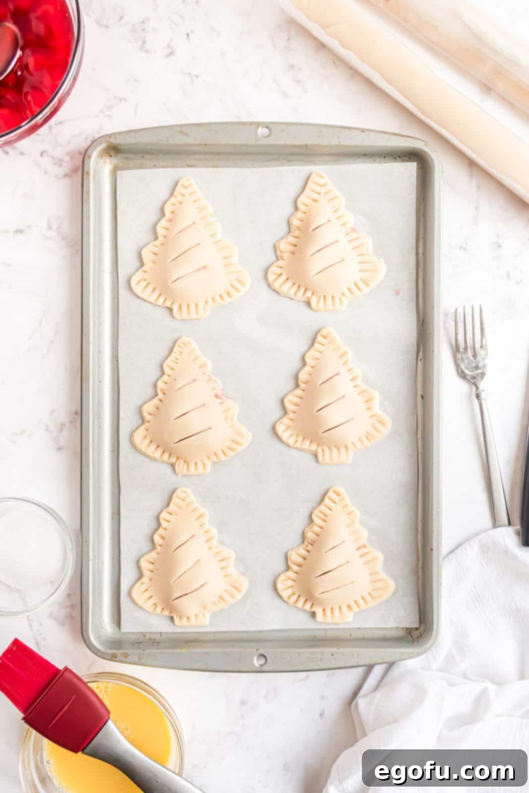 Slits cut on top of each hand pie to allow steam to escape during baking.