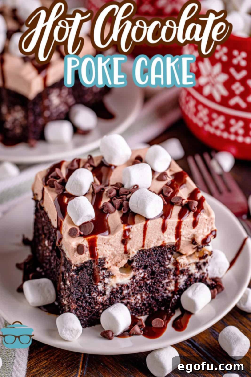 slice of hot chocolate cake on a small white plate with mini marshmallows sprinkled around.