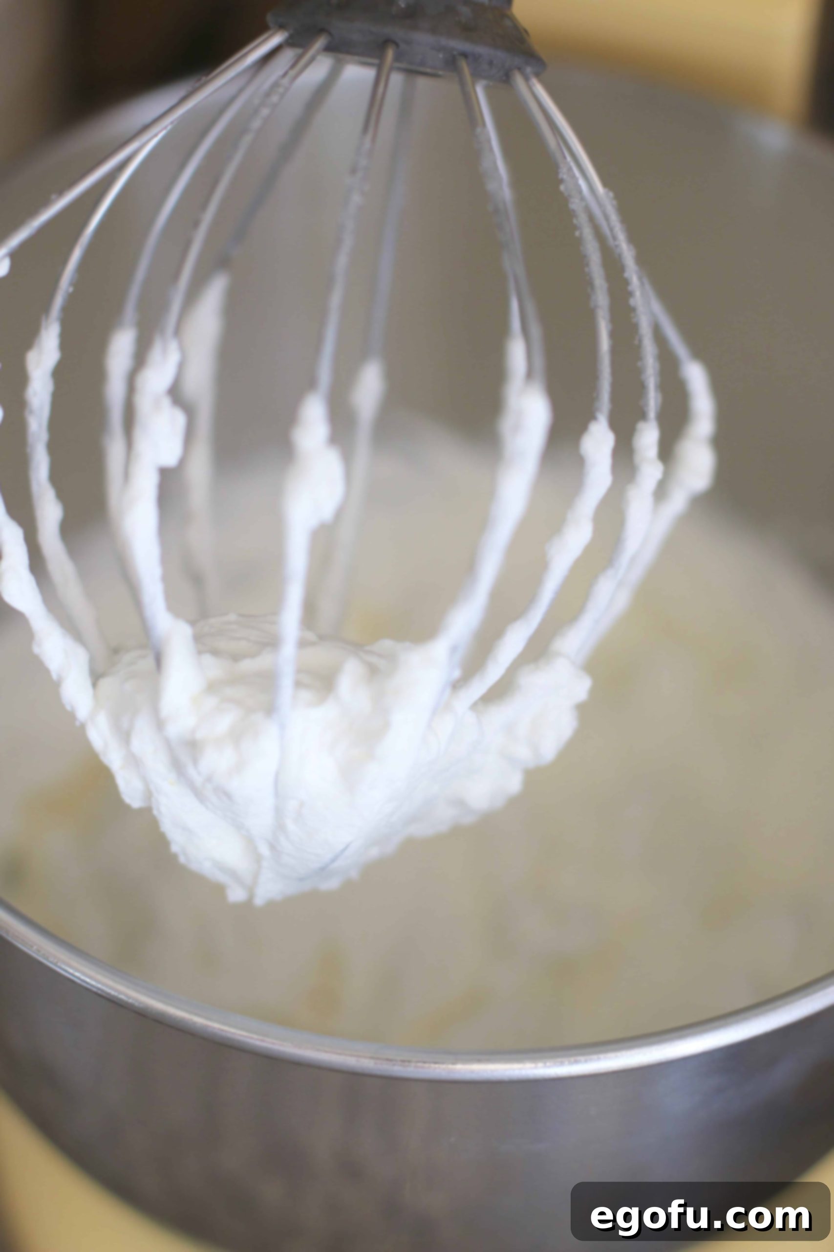 Making homemade whipped cream in a stand mixer.