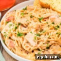 Closely looking at a bowl of Chicken Spaghetti, highlighting its rich, creamy texture and delicious appeal.