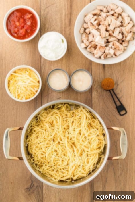 Cooked angel hair pasta in a strainer.