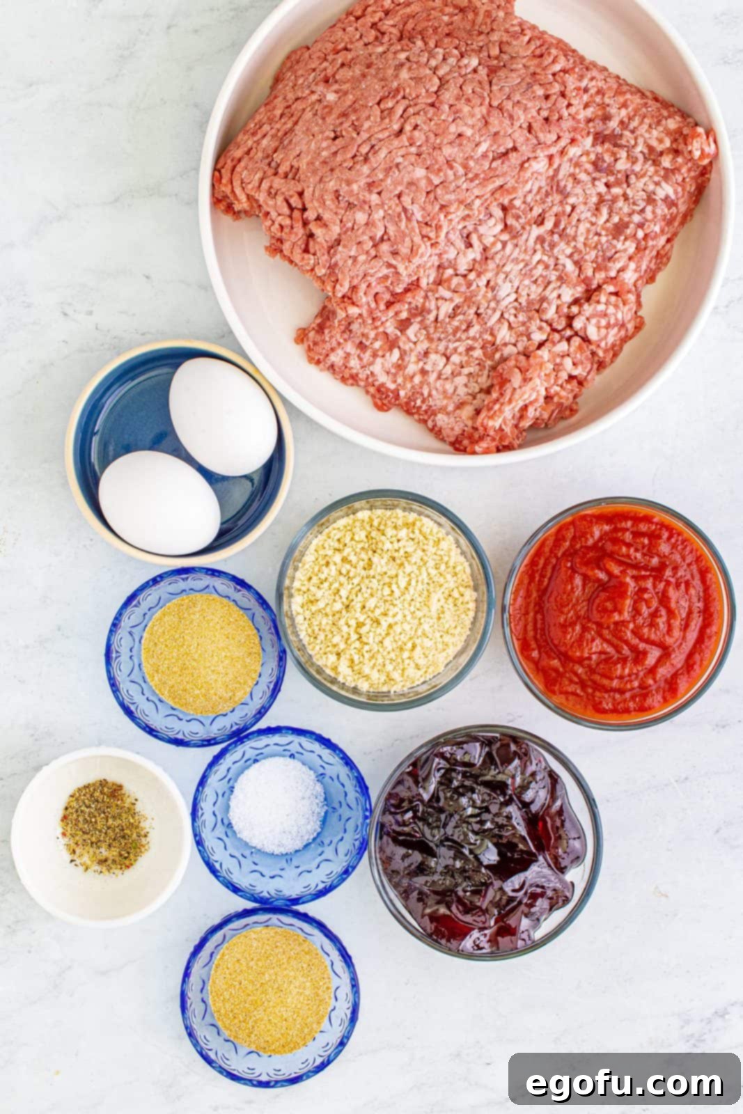 Sweet & Tangy Grape Jelly Meatballs 4 Ingredients needed: eggs, panko breadcrumbs, garlic powder, onion powder, kosher salt, pepper, ground beef, ground pork, grape jelly, chili sauce and parsley.
