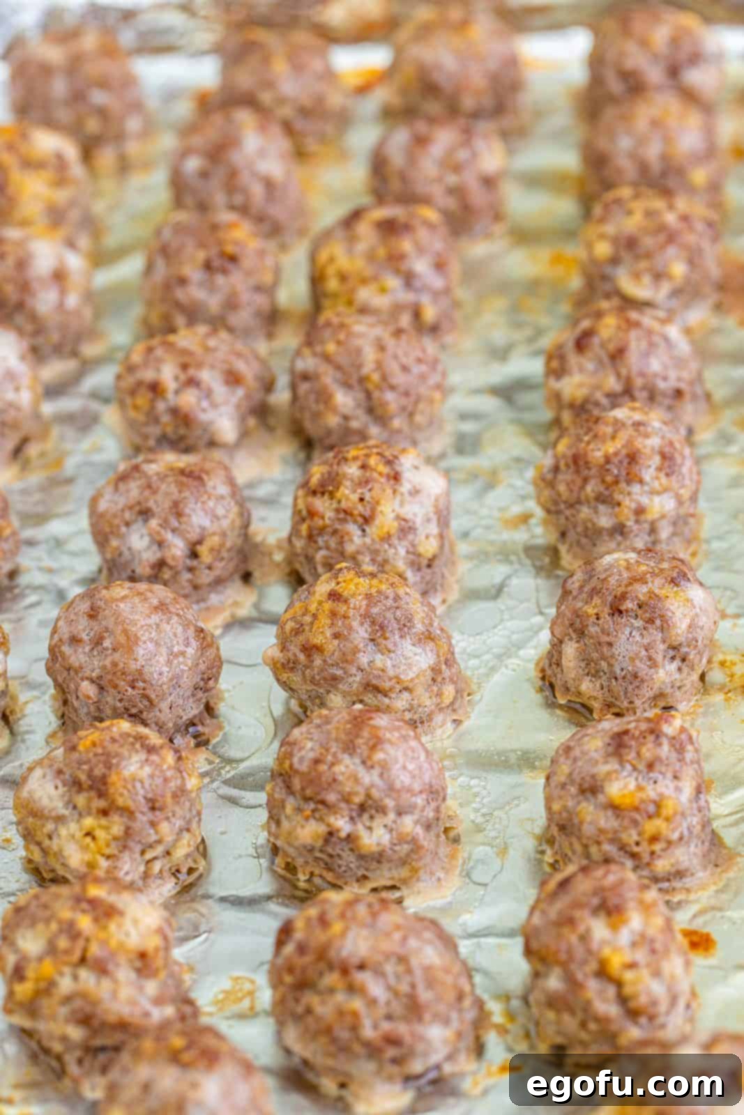 Sweet & Tangy Grape Jelly Meatballs 8 Baked meatballs out of oven.