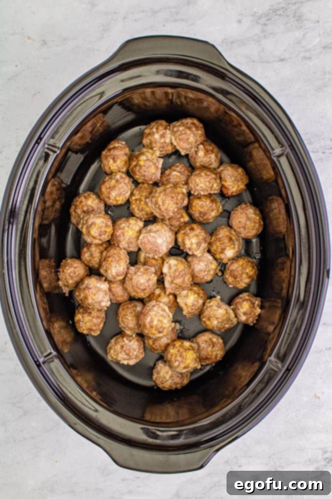 Sweet & Tangy Grape Jelly Meatballs 9 Meatballs placed in crock pot.