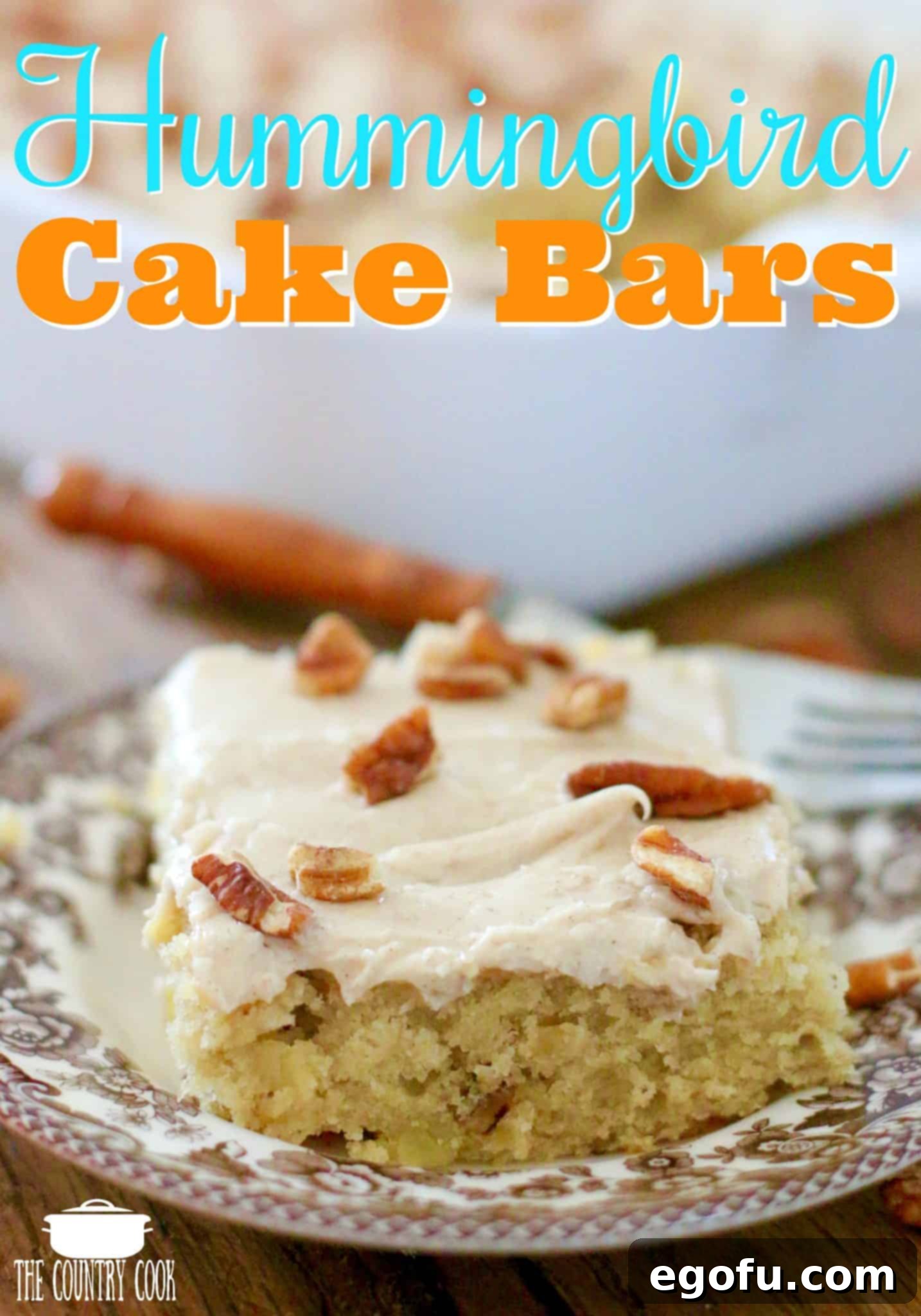 A perfectly cut slice of Hummingbird Cake Bars, showcasing the moist interior and generous cinnamon cream cheese frosting.