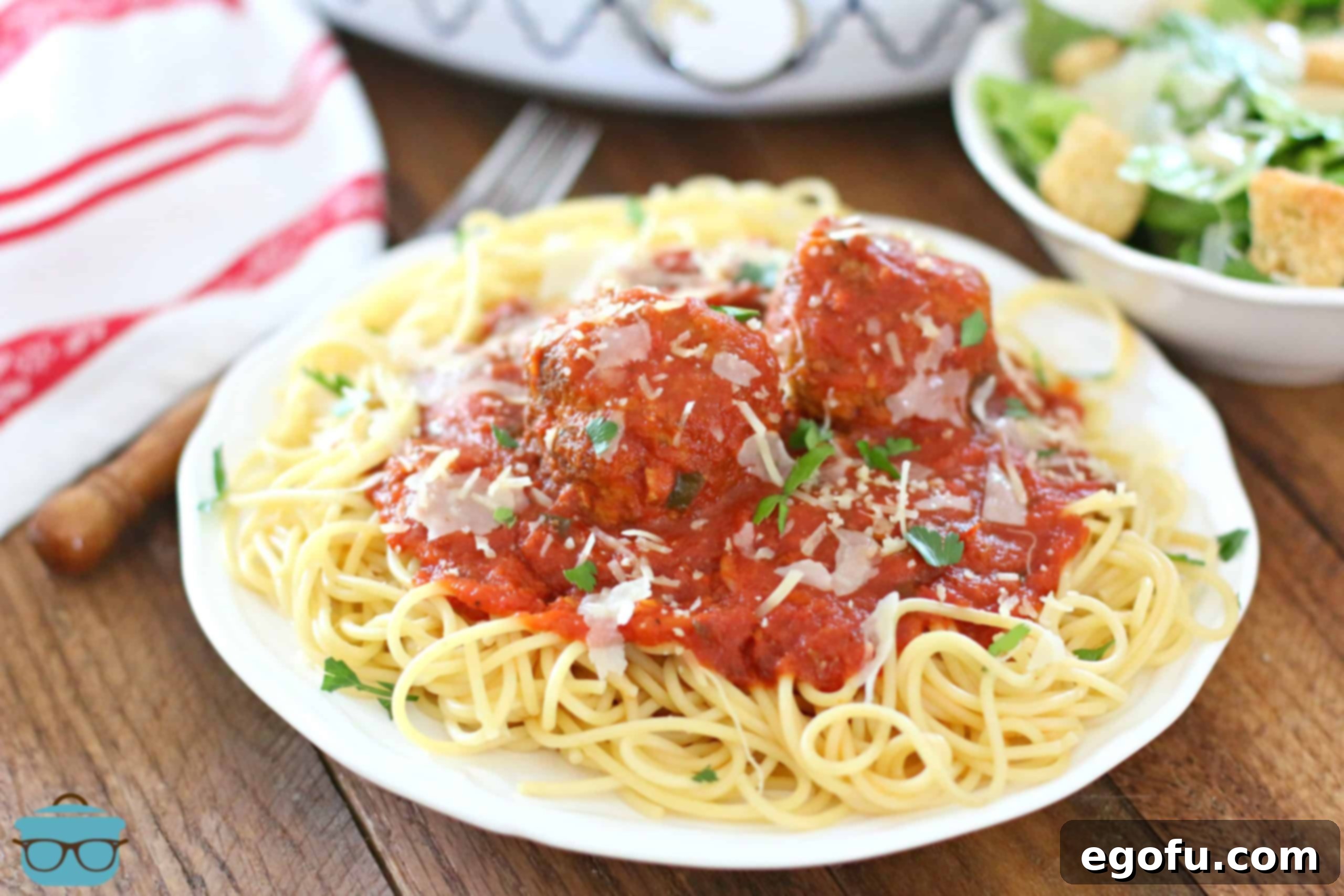 Slow Simmered Homemade Meatballs with Zesty Marinara 15 plate of spaghetti and marinara sauce with meatballs on a white circle plate