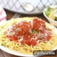 Slow Simmered Homemade Meatballs with Zesty Marinara 16 Slow Cooker Homemade Italian Marinara Spaghetti Sauce with Homemade Beef Meatballs on top of cooked spaghetti