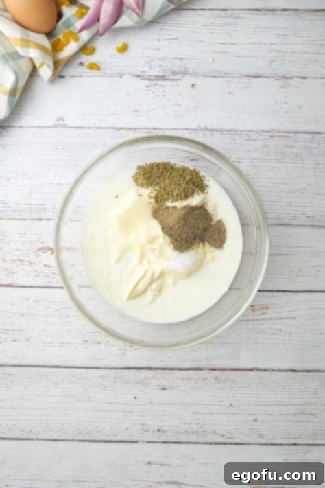 Creamy Hawaiian Macaroni Salad 12 dressing ingredients added to a bowl.