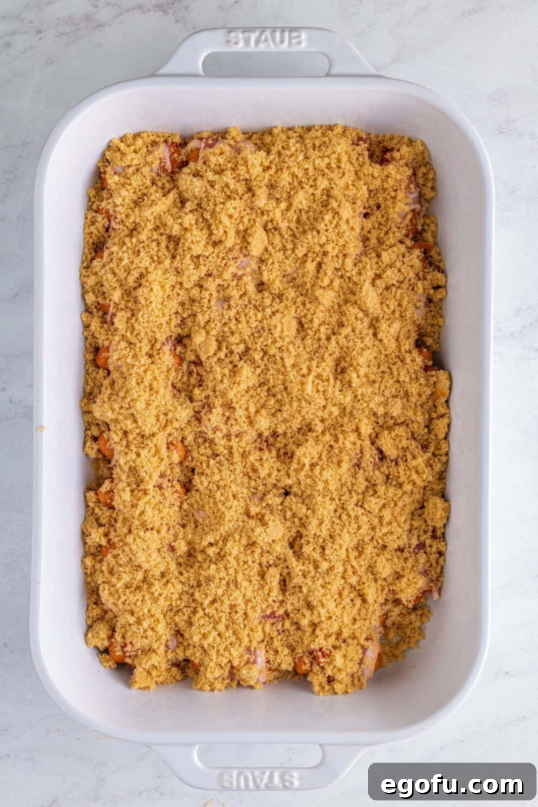 Crispy Bacon Sausage Bites 7 Brown sugar mixture sprinkled over smokies in baking dish.