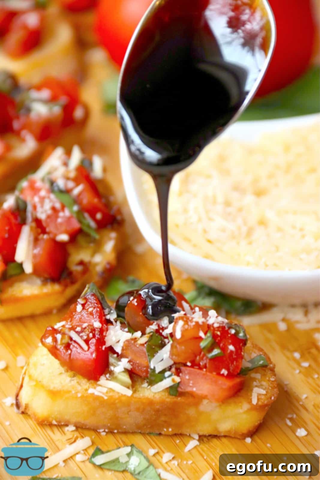 Garlic Parmesan Crostini 2 Balsamic glaze being drizzled over Parmesan Bruschetta.