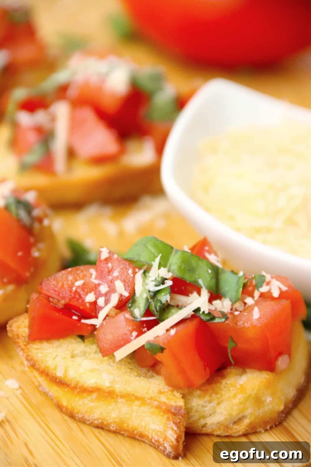 Garlic Parmesan Crostini 9 Close up of one baguette slice with Parmesan Bruschetta on it.