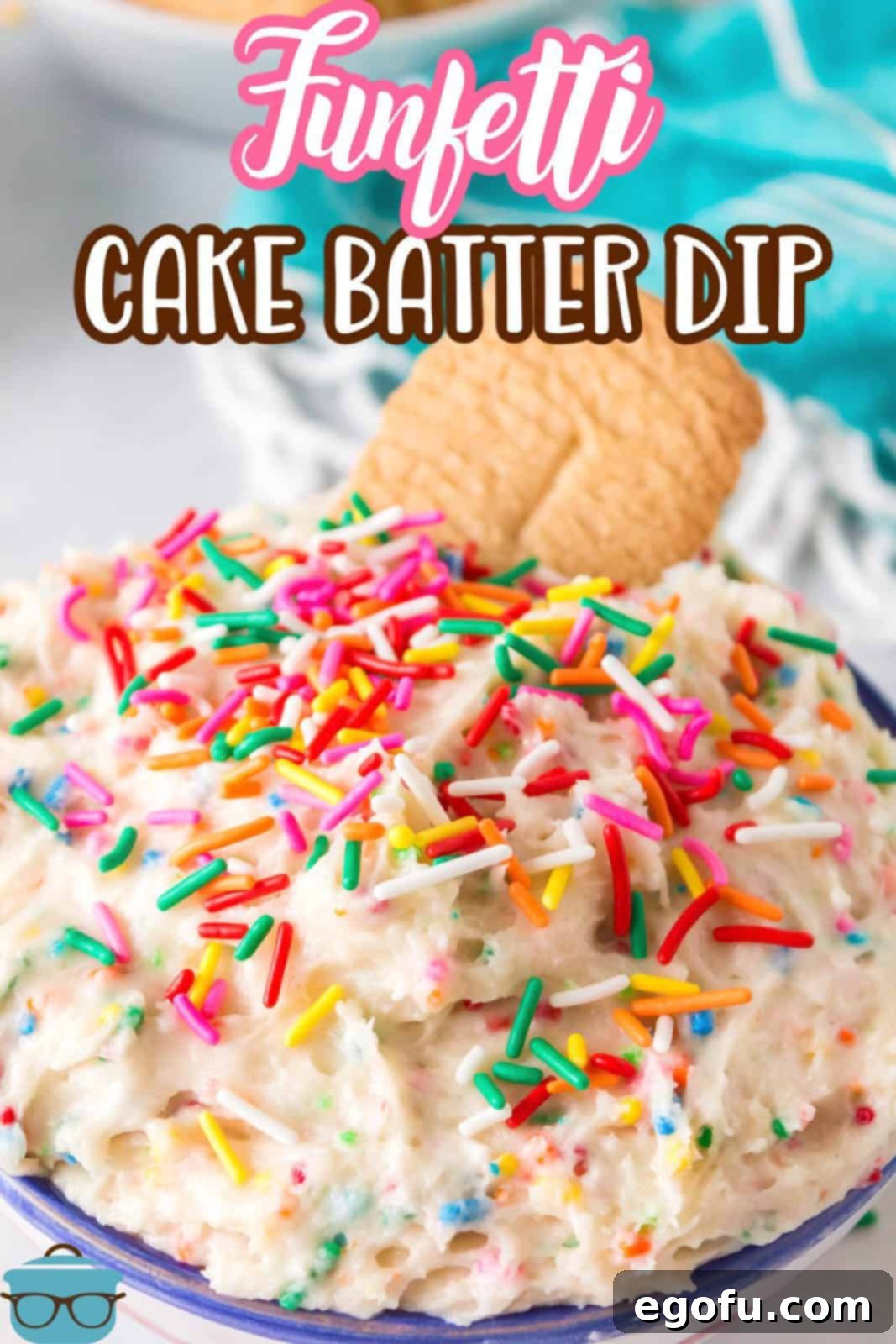 Confetti Cake Bliss 3 Close-up shot of Funfetti Cake Batter Dip in a white bowl, adorned with sprinkles and a vanilla wafer cookie dipped in, ready to be enjoyed.