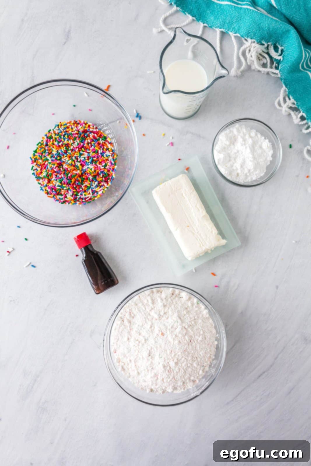 Confetti Cake Bliss 4 All the required ingredients for Funfetti Cake Batter Dip laid out: Betty Crocker Super Moist Party Rainbow Chip cake mix, cream cheese, milk, vanilla extract, powdered sugar, and rainbow sprinkles.