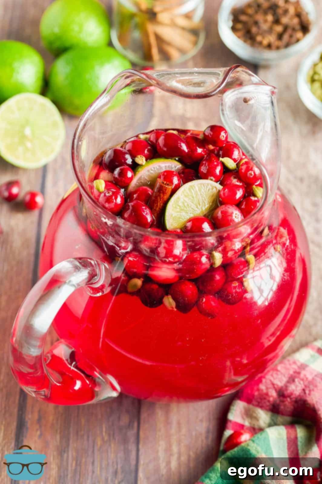 Crimson Bubbly 7 Finished Cranberry Wine Spritzer in pitcher with garnishes. Ready to be served to delighted guests.