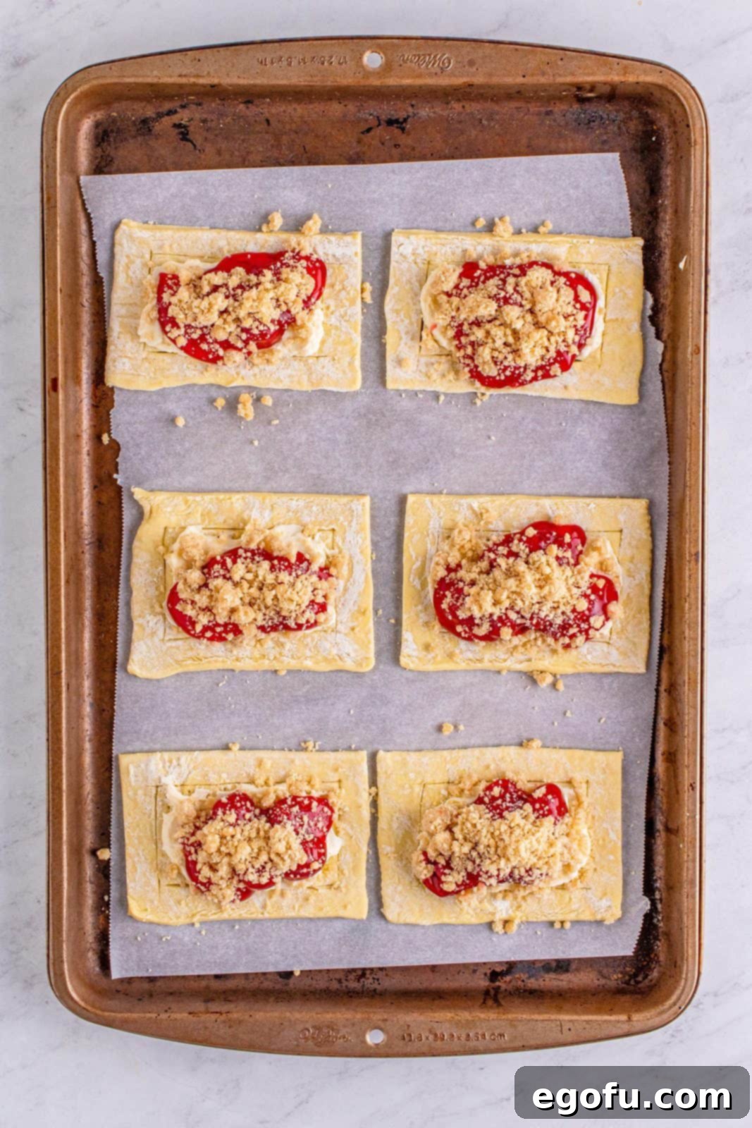 Buttery Cherry Crumble Danishes 11 Crumble topping added to top of cherry pie filling.
