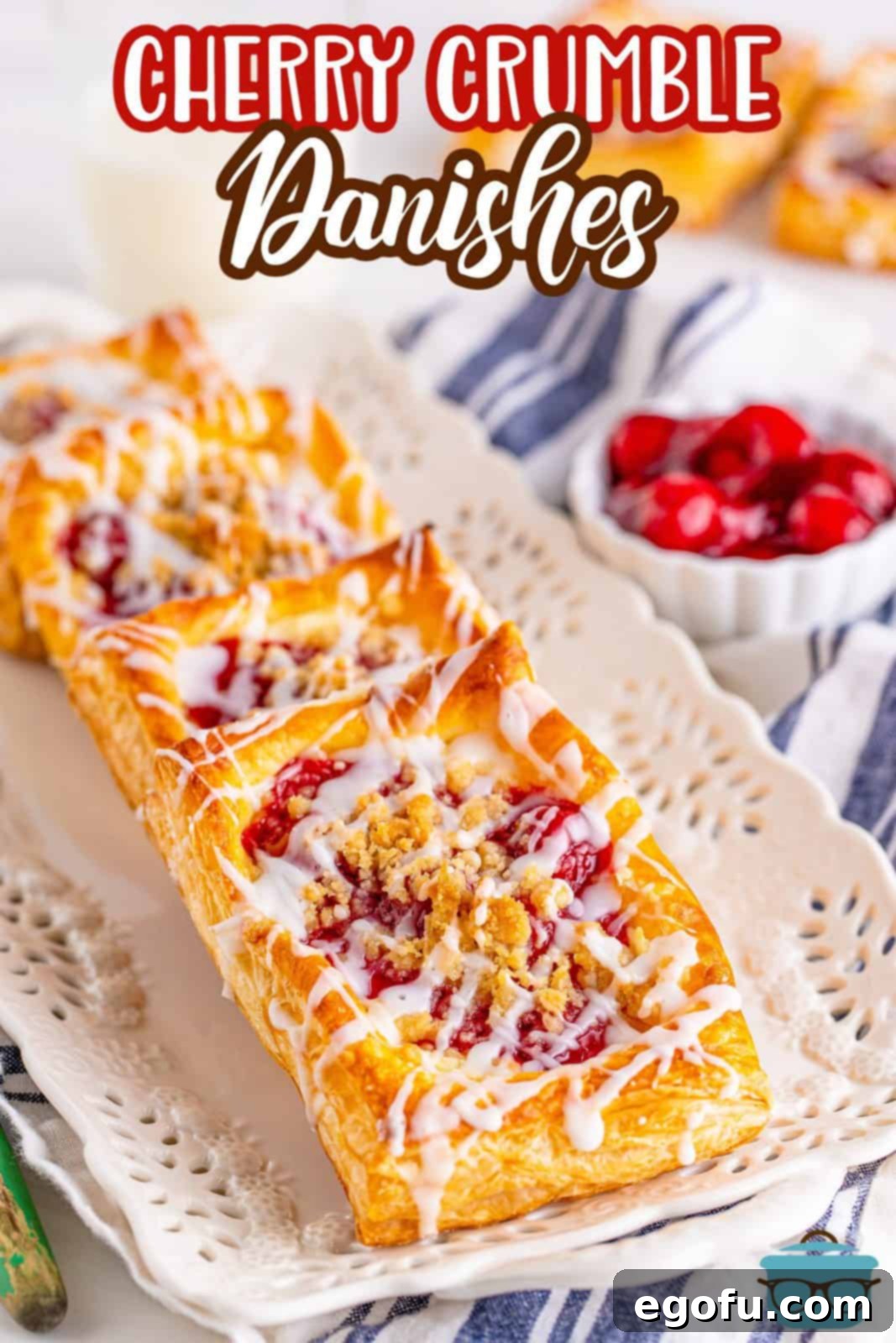 Buttery Cherry Crumble Danishes 3 Pinterest image of layered Cherry Crumble Danishes on white plater.