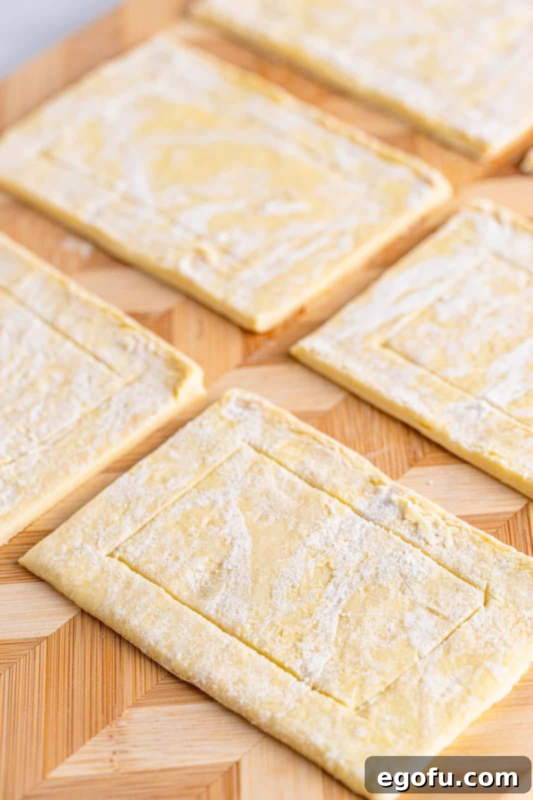 Buttery Cherry Crumble Danishes 7 Puff pastry cut into rectangles scored on the sides.