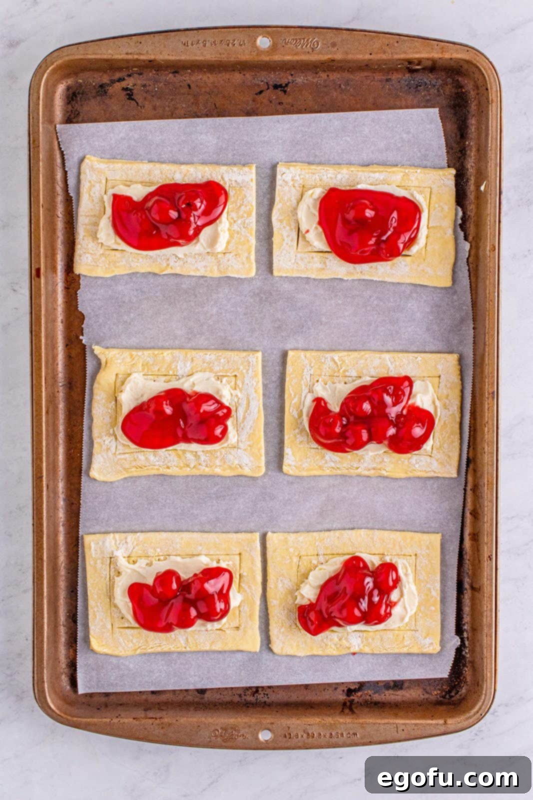 Buttery Cherry Crumble Danishes 10 Cherry pie filling added to top of cream cheese mixture.