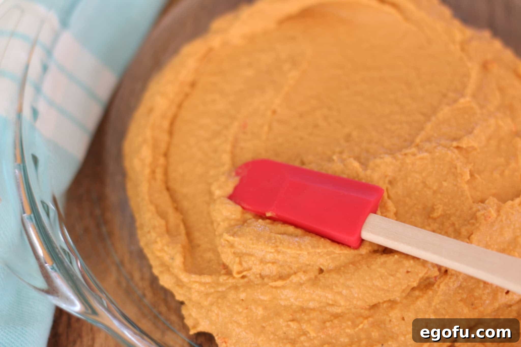 roasted red pepper hummus spread into Pyrex pie pan.