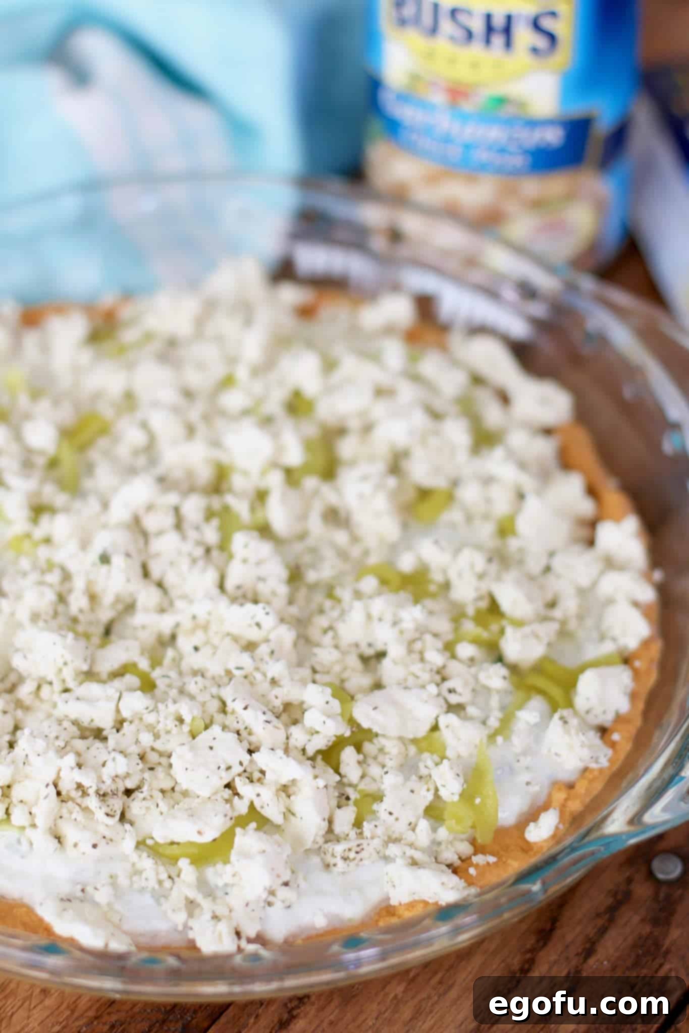 mediterranean Feta cheese crumbles added to dip layers.