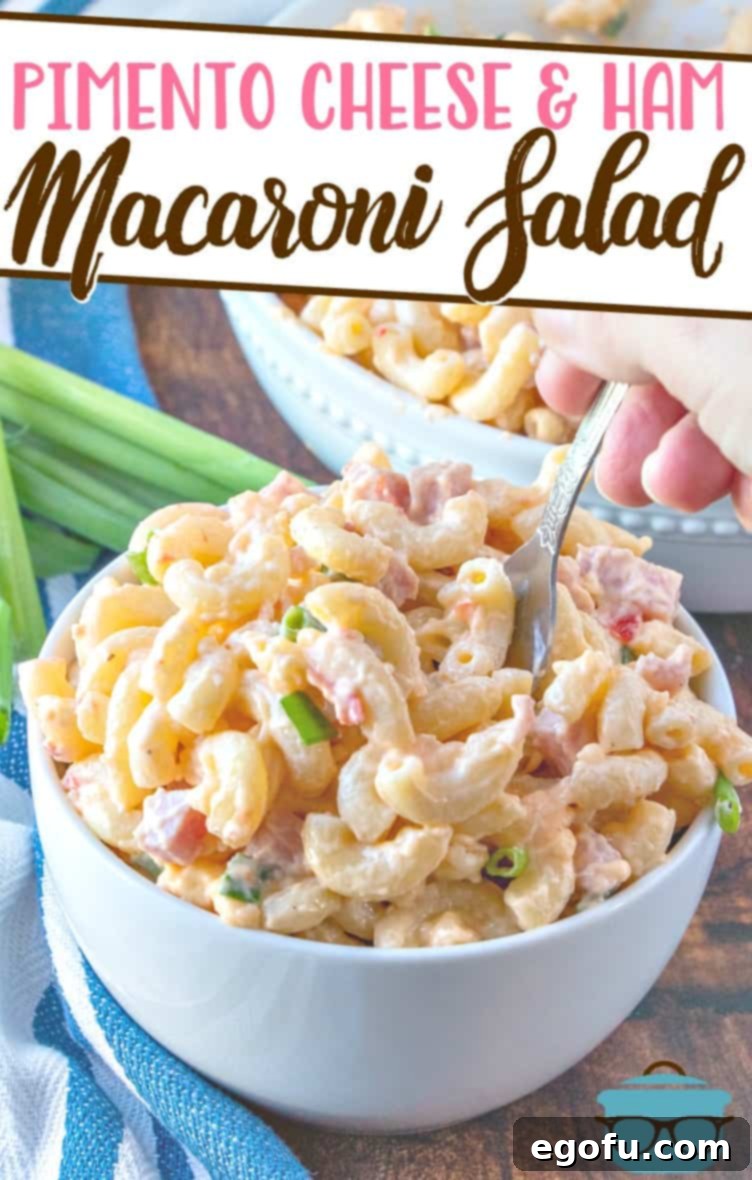 Homestyle Pimiento Macaroni Salad 3 Pimento Cheese and Ham Macaroni Salad recipe from The Country Cook, pictured in two serving bowls with a fork going into the macaroni salad.
