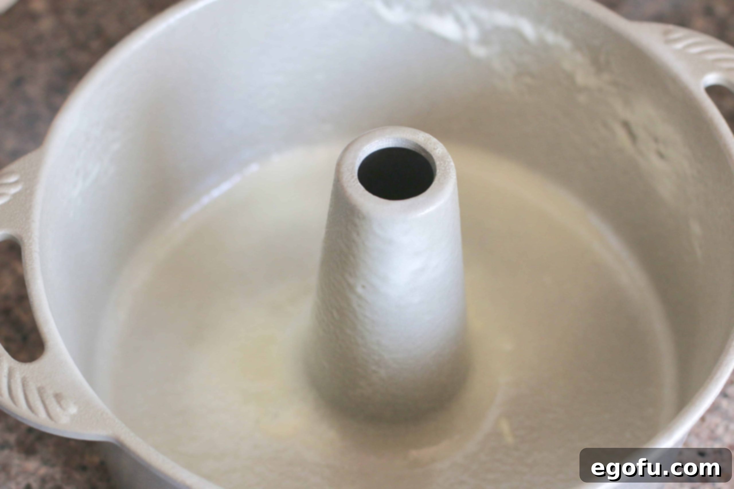 Heirloom Southern Pecan Pound Cake 5 A 12-cup bundt pan thoroughly coated with nonstick cooking spray, ready to receive the pound cake batter, ensuring easy release after baking.