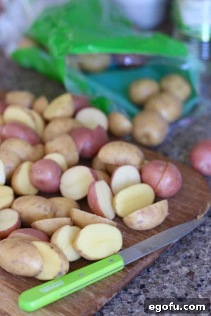Sliced little potatoes ready for cooking, ensuring consistent size for French Potato Salad.