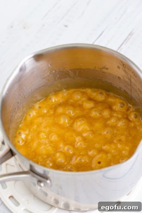 Christmas Caramel Cracker Crunch 12 butter an brown sugar boiling in pot.