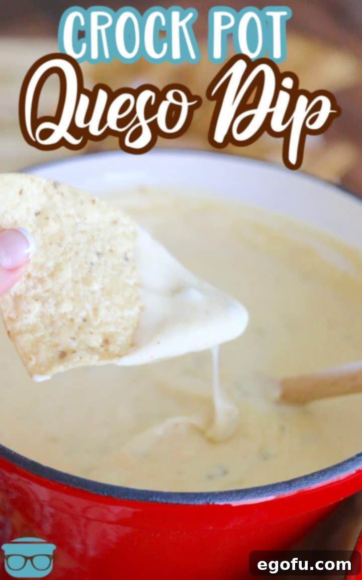White Queso Dip shown in a small red slow cooker. 