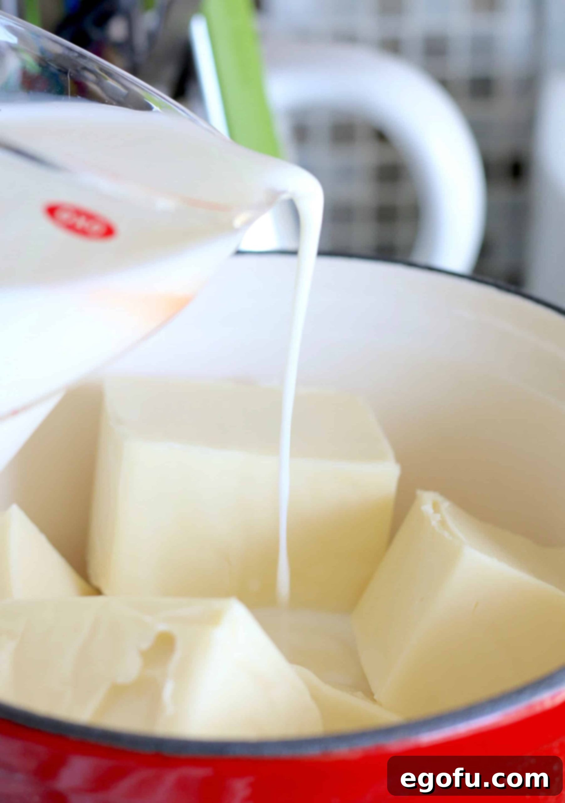 milk pouring into slow cooker.