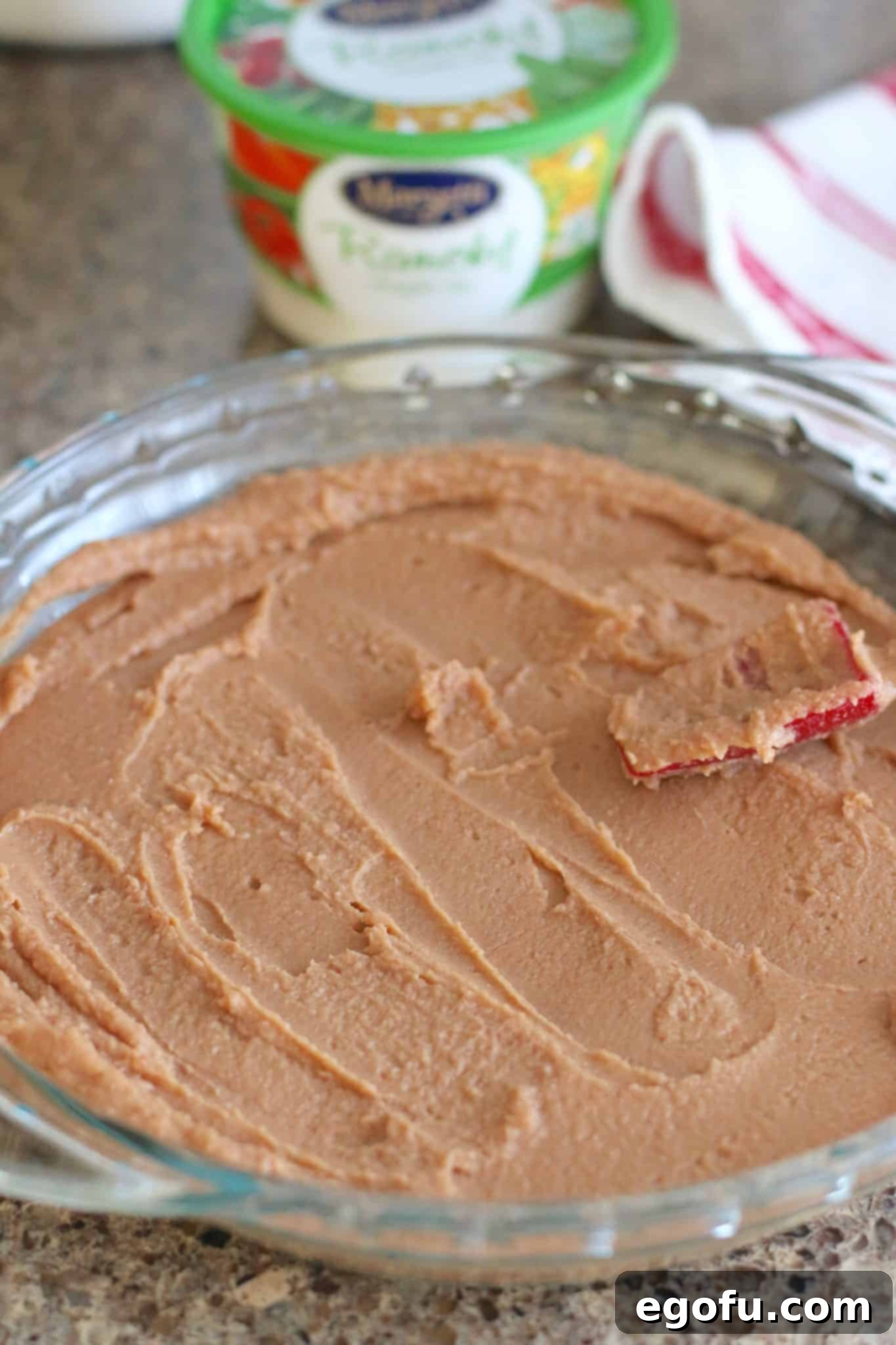 bean dip spread into pie pan