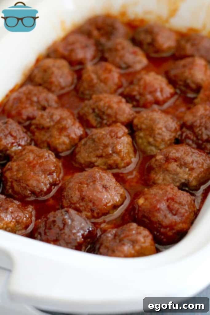 fully cooked homemade meatballs covered in sauce in a casserole slow cooker